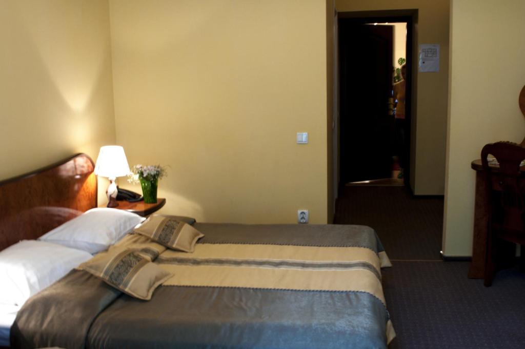 Postel nebo postele na pokoji v ubytování Wien Hotel
