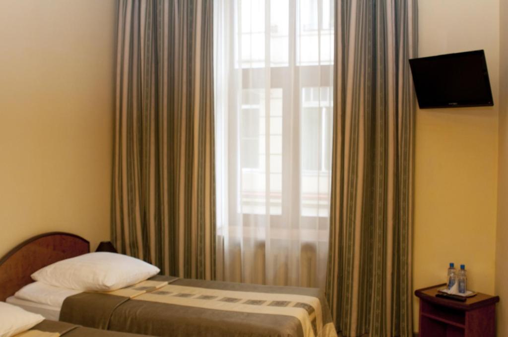 Postel nebo postele na pokoji v ubytování Wien Hotel