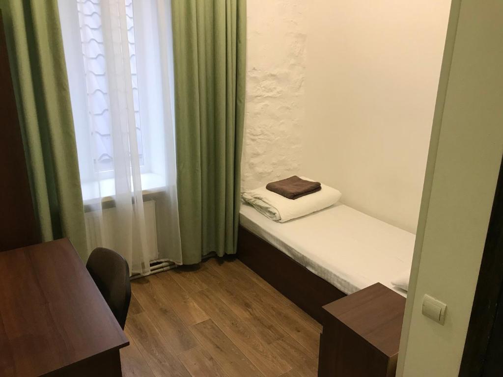 Postel nebo postele na pokoji v ubytování FOX Hostel