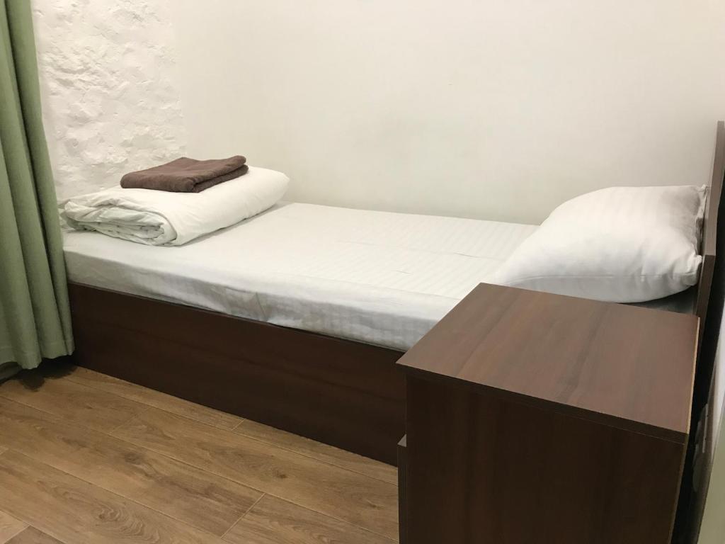 Postel nebo postele na pokoji v ubytování FOX Hostel