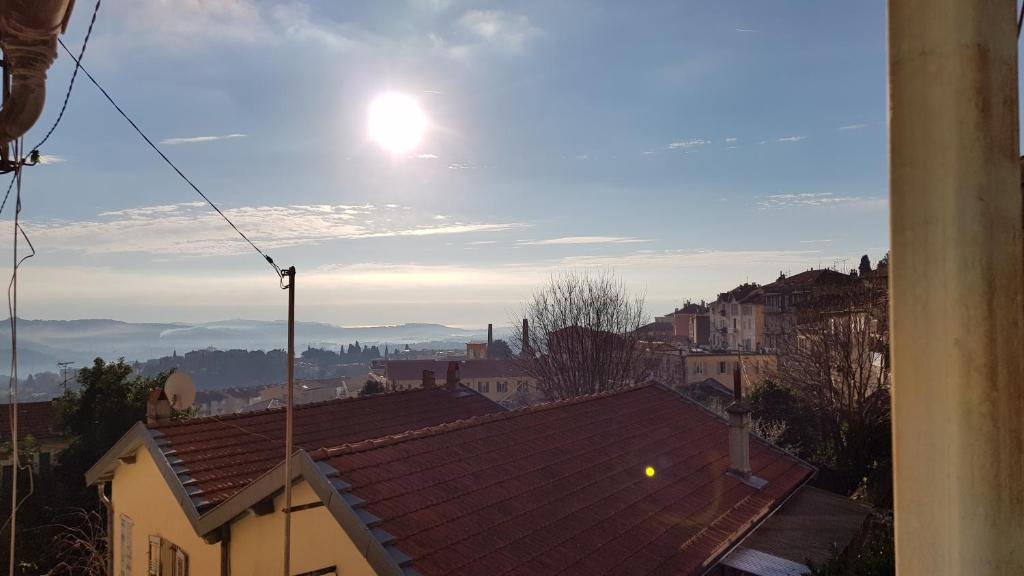 a view of the roofs of buildings in a city at Studio Grasse Centre in Grasse