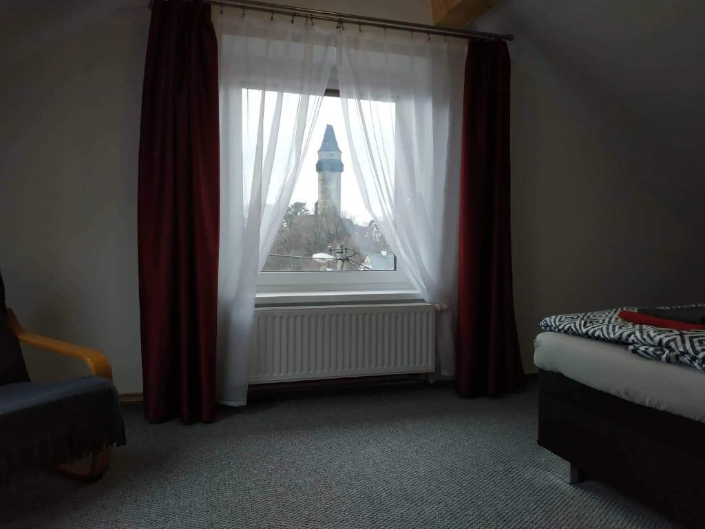 Postel nebo postele na pokoji v ubytování Bílá hora Štramberk