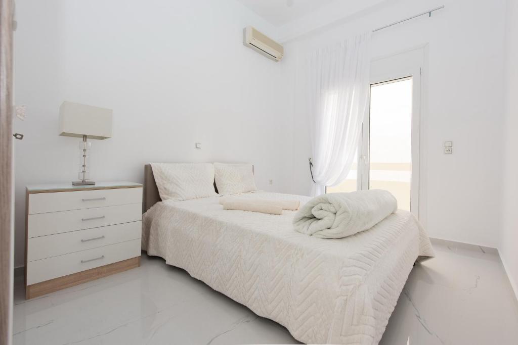 Postel nebo postele na pokoji v ubytování Despina's Luxury apt downtown