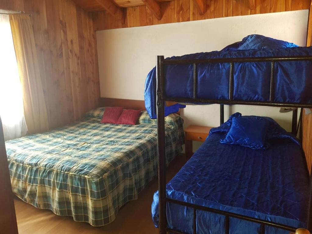 Postel nebo postele na pokoji v ubytování Hostal Maitahue
