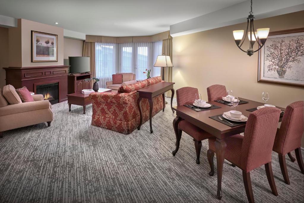 a living room with a couch and a table at Residences at the Sun Peaks Grand in Sun Peaks