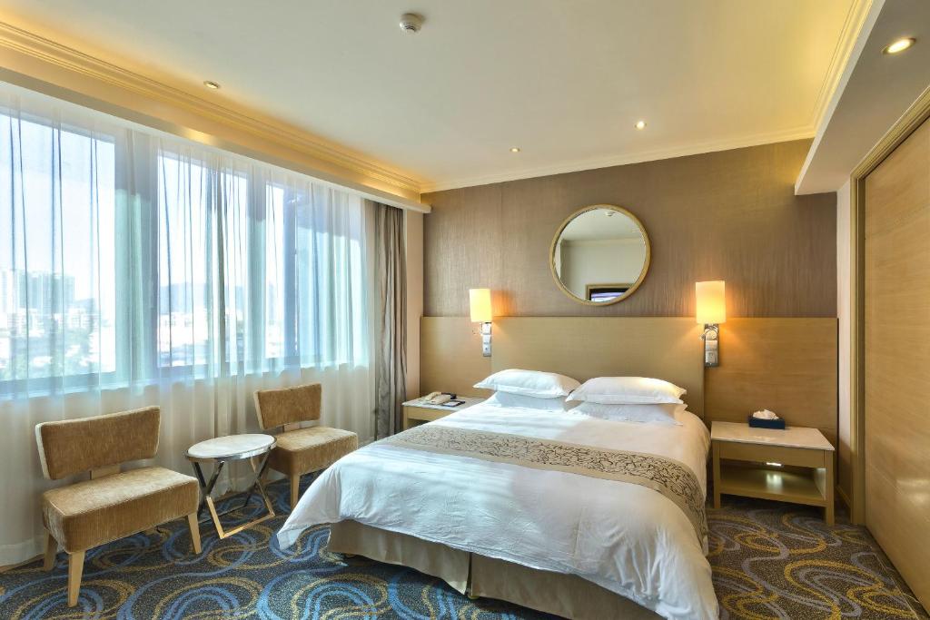Postelja oz. postelje v sobi nastanitve Ocean Hotel Guangzhou-Free Shuttle Bus to Canton Fair