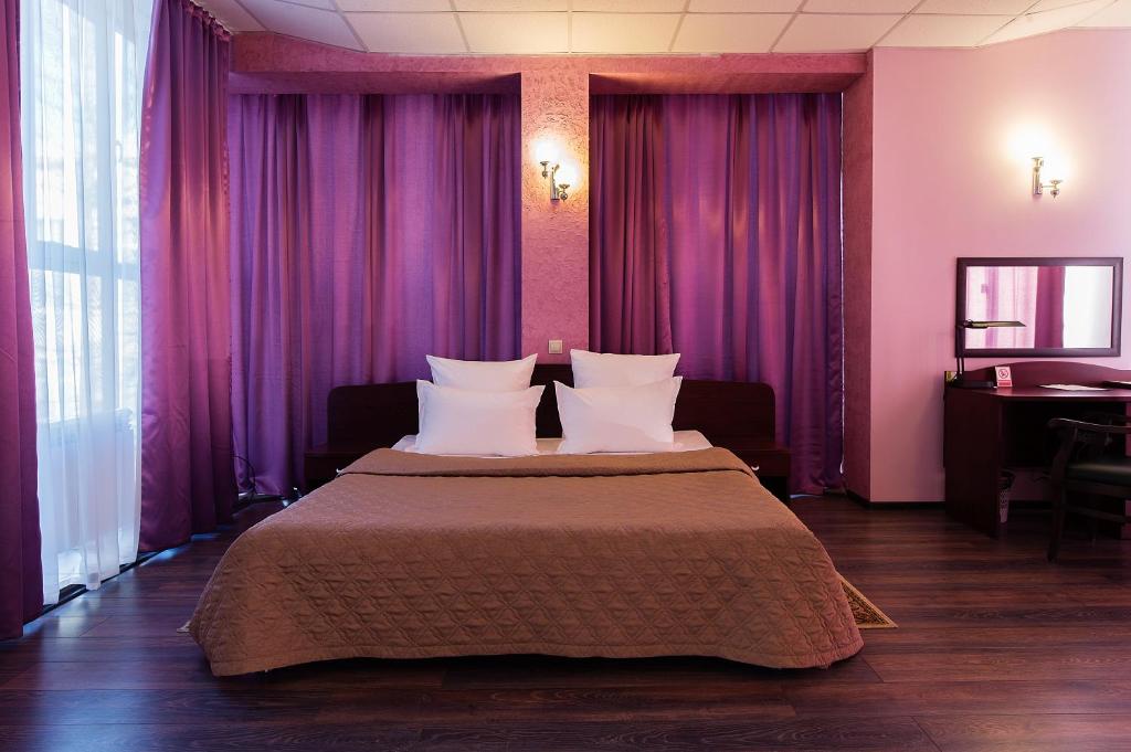 
Ein Bett oder Betten in einem Zimmer der Unterkunft Hotel Ulitka
