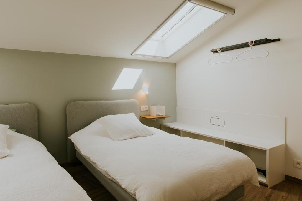Postel nebo postele na pokoji v ubytování Hotel Jerom