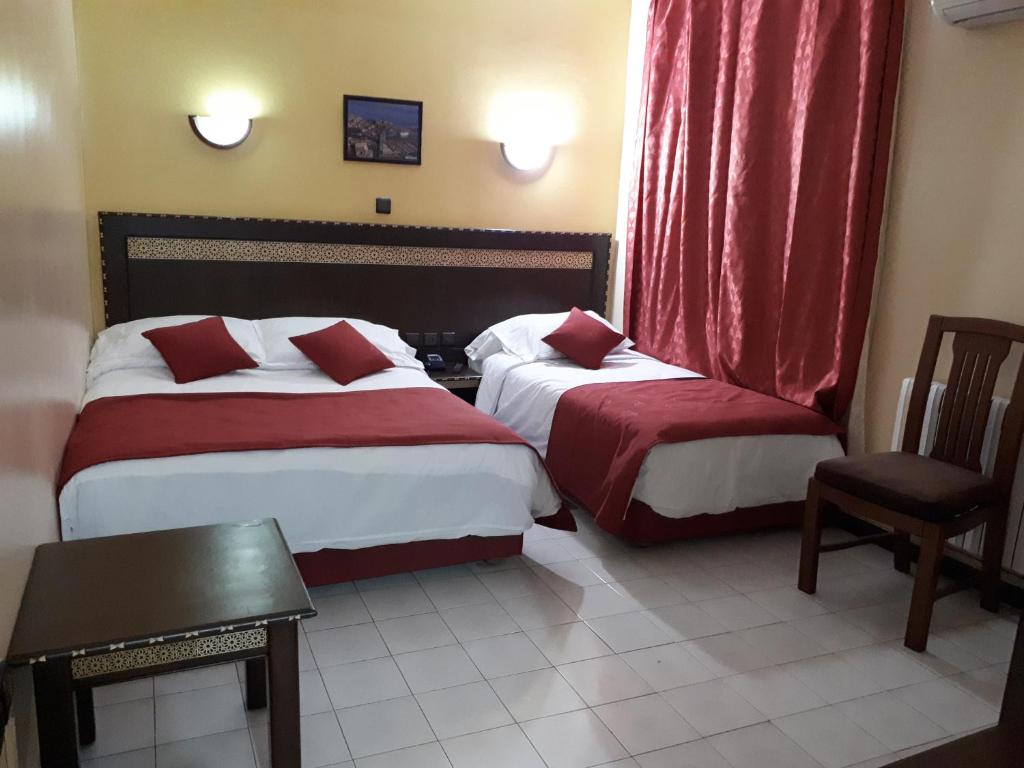 Postel nebo postele na pokoji v ubytování Hotel Lixus