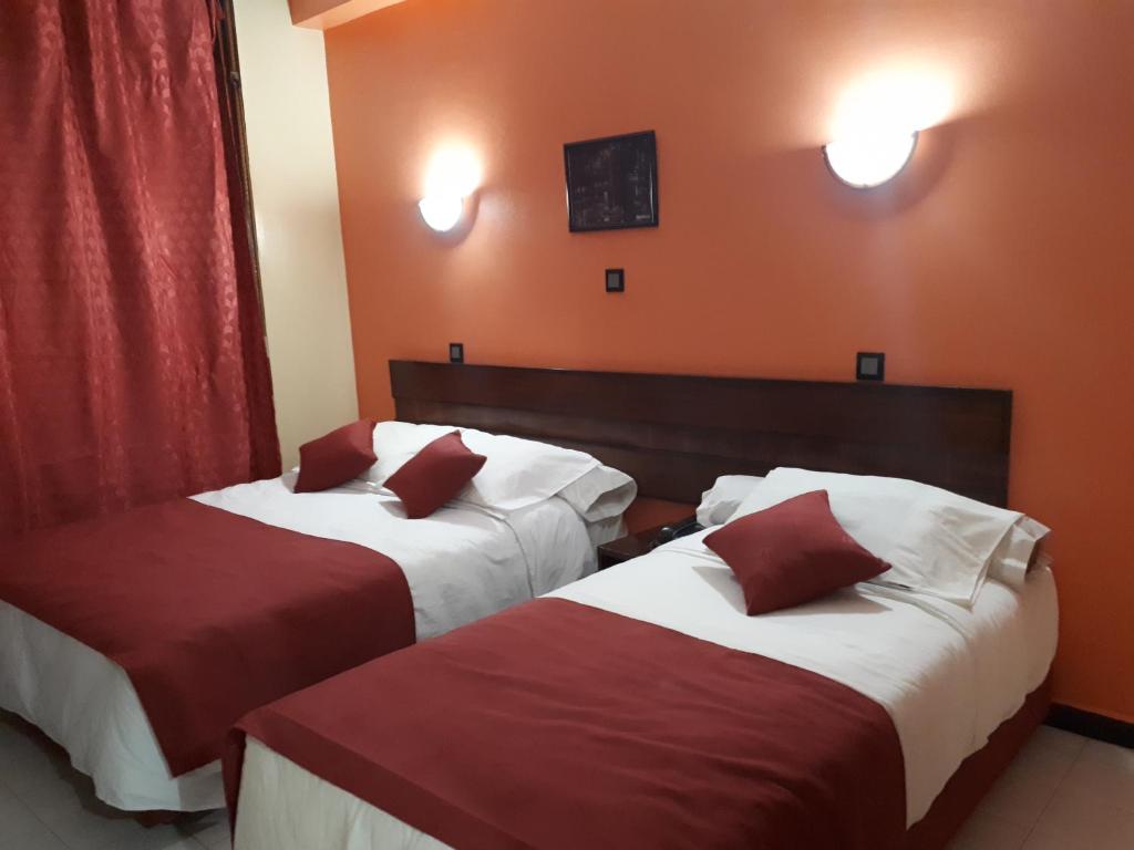 Postel nebo postele na pokoji v ubytování Hotel Lixus