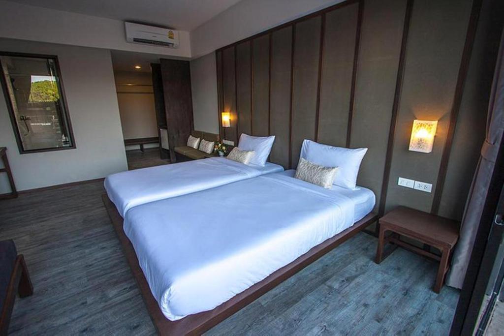 Postel nebo postele na pokoji v ubytování La Lune Beach Resort