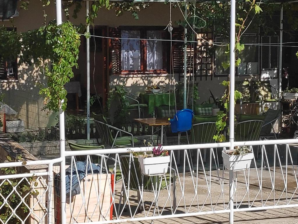 a porch with potted plants and a table at Apartments Niko in Omiš