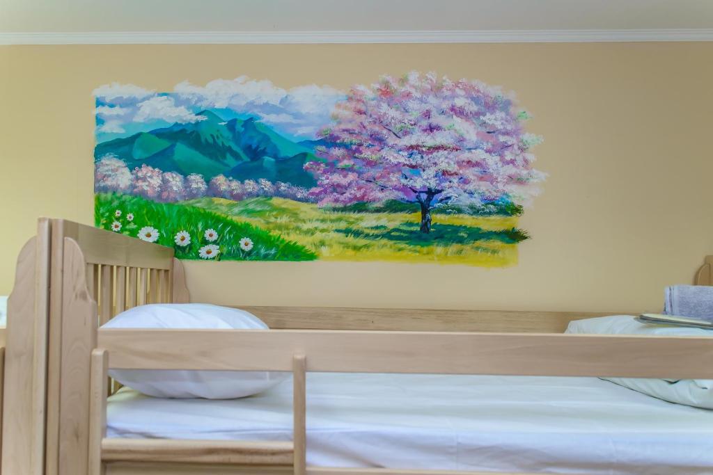 Postel nebo postele na pokoji v ubytování BOTANIC GLOBUS HOSTEL