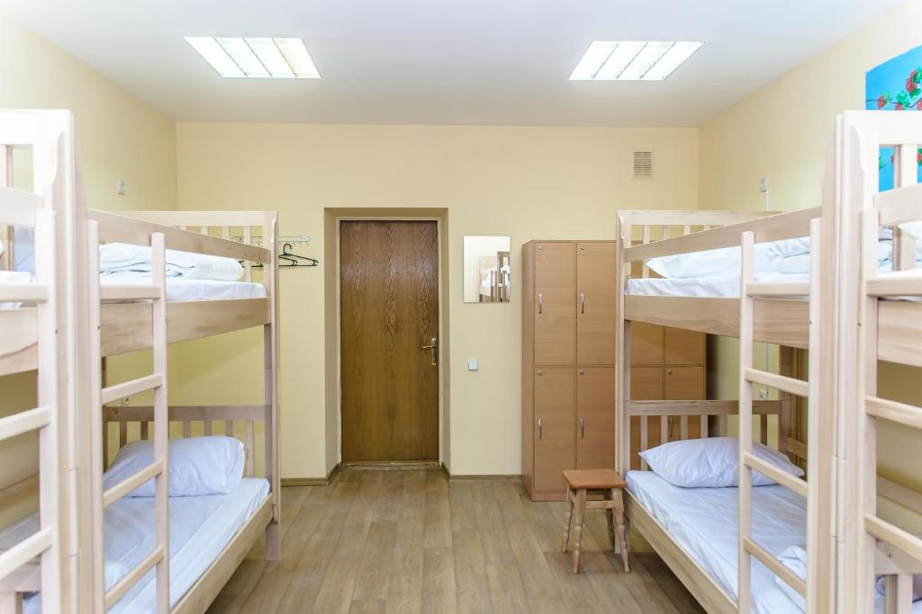 Postel nebo postele na pokoji v ubytování BOTANIC GLOBUS HOSTEL