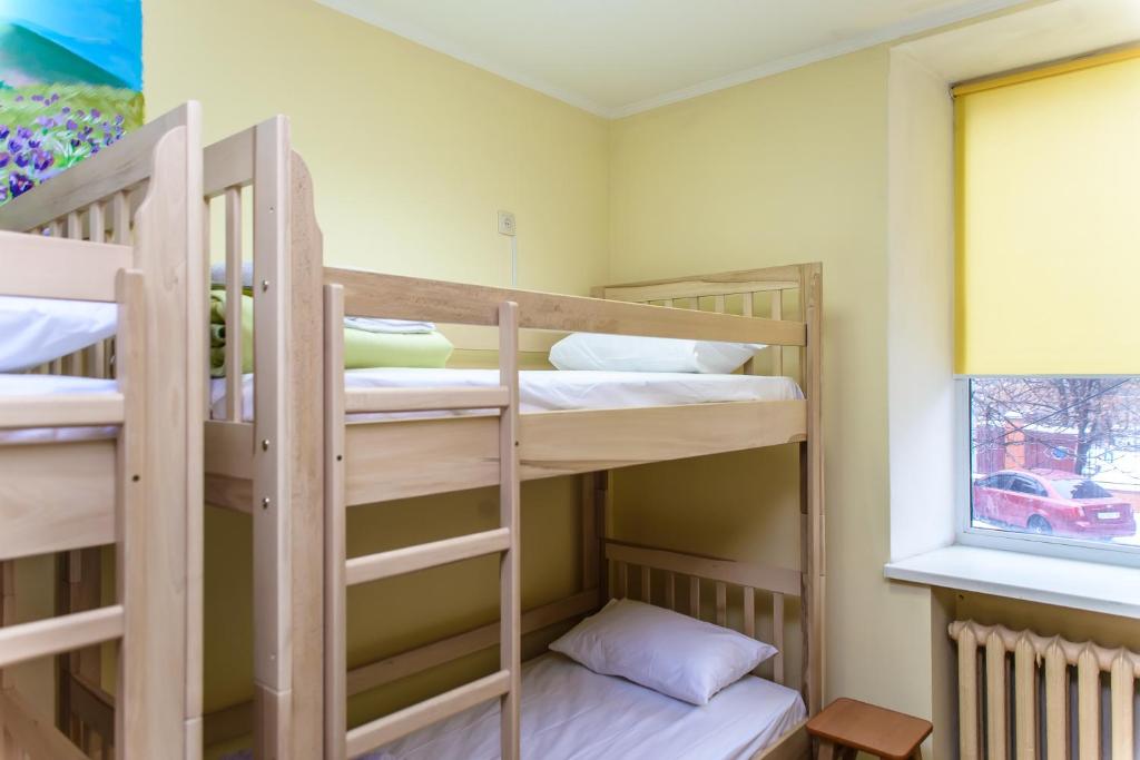 Postel nebo postele na pokoji v ubytování BOTANIC GLOBUS HOSTEL