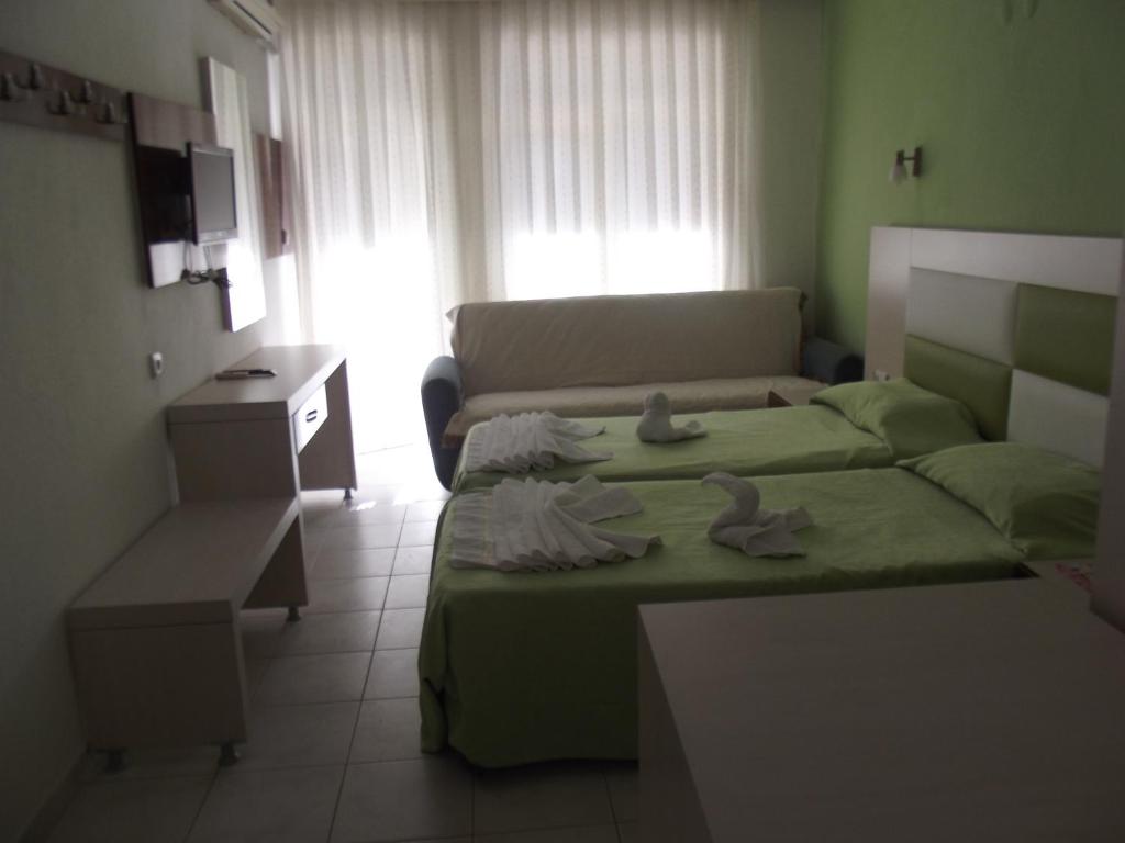 Postel nebo postele na pokoji v ubytování Derya Motel