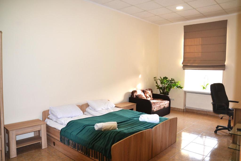Postel nebo postele na pokoji v ubytování Coin Apartments & Poshtel
