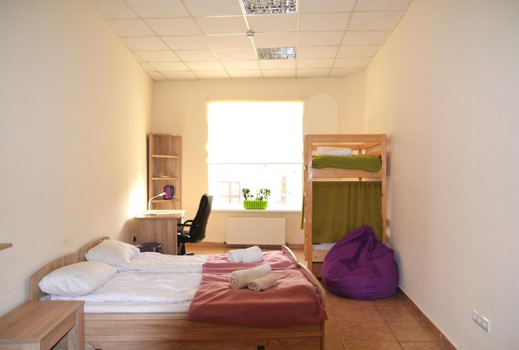 Postel nebo postele na pokoji v ubytování Coin Apartments & Poshtel