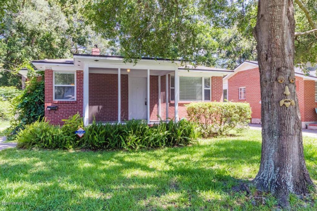 a red brick house with a tree in the yard at Hist Two Bedroom Home in Avondale Riverside Jacksonville in Jacksonville