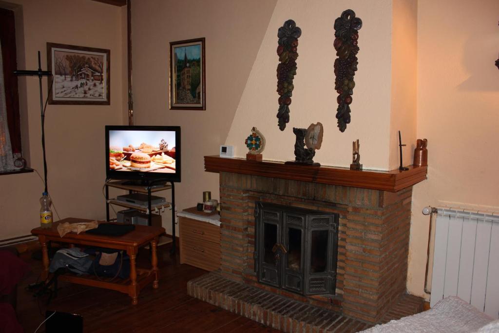 TV a/nebo společenská místnost v ubytování Casa Aranesa