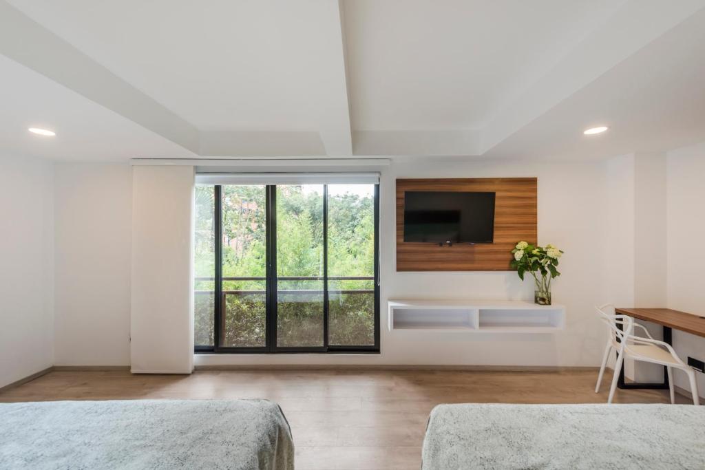 Postel nebo postele na pokoji v ubytování Foresta Hotel