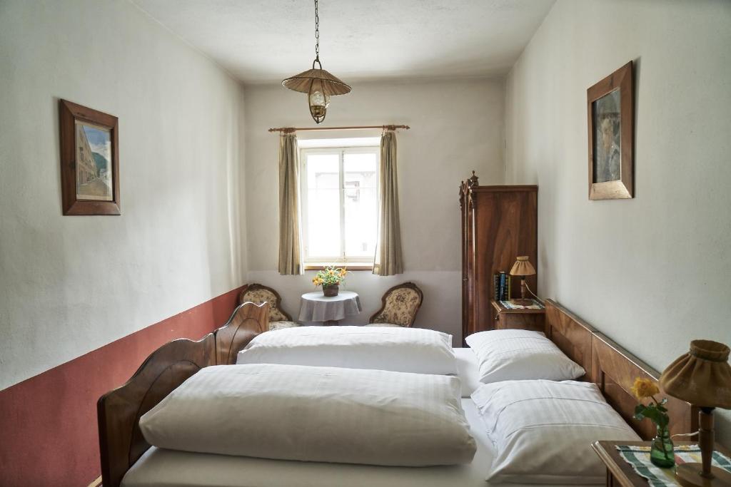 Postel nebo postele na pokoji v ubytování Hotel Post Mauterndorf OG