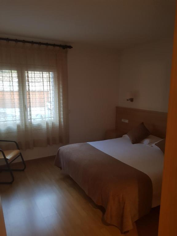 Postel nebo postele na pokoji v ubytování Apartaments Turistics Pirineu