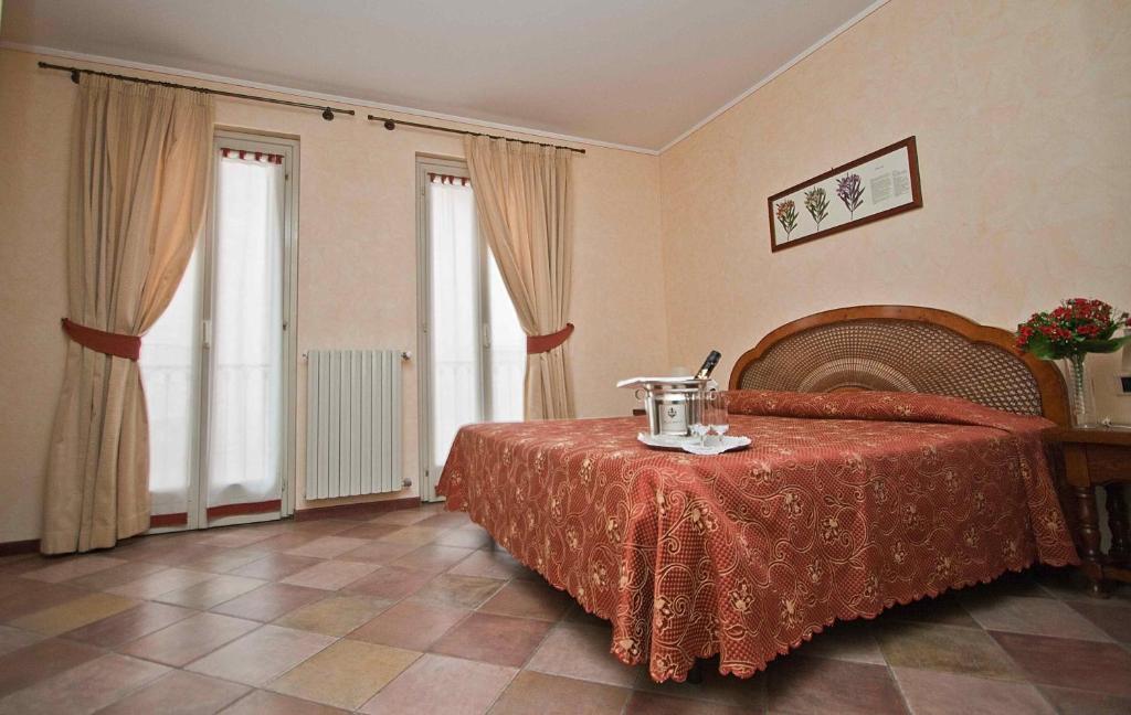 Postel nebo postele na pokoji v ubytování Hotel Aquadolce