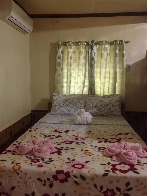 Postel nebo postele na pokoji v ubytování Pitaya Native Guest House