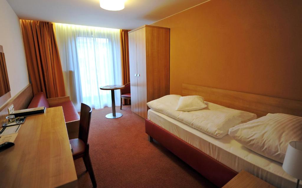 Postel nebo postele na pokoji v ubytování Hotel Club