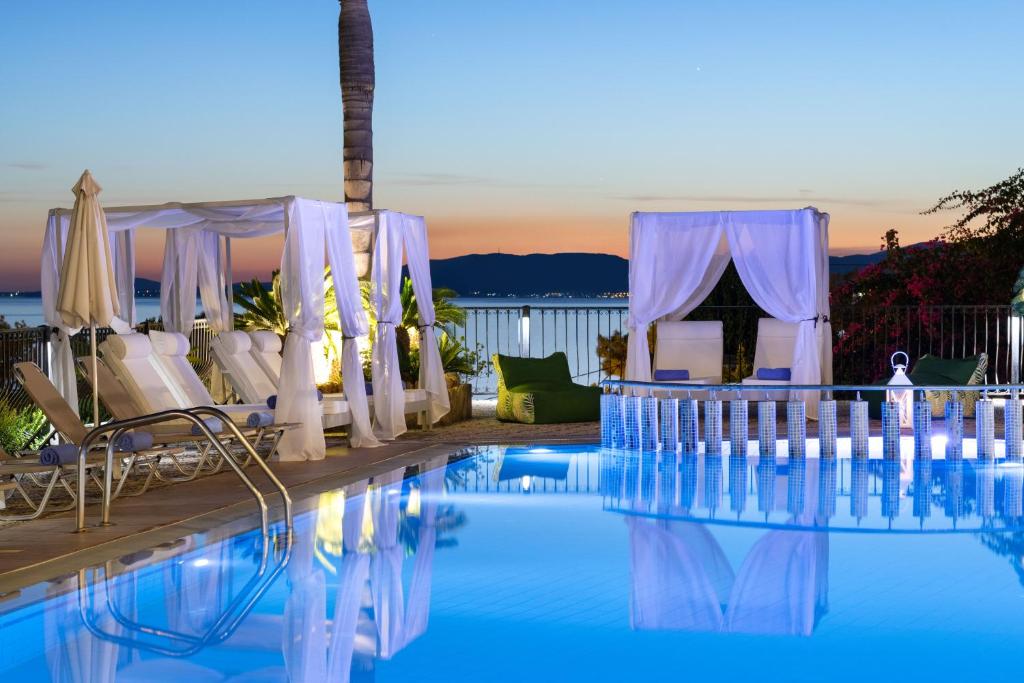 a wedding set up by the pool at a resort at Pefkos View Suites & Maisonette in Pefki