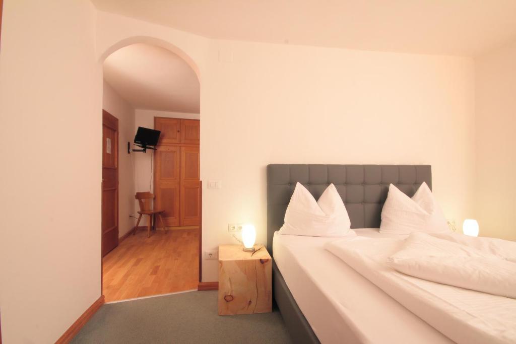 Postel nebo postele na pokoji v ubytování Pension & Residence Astoria