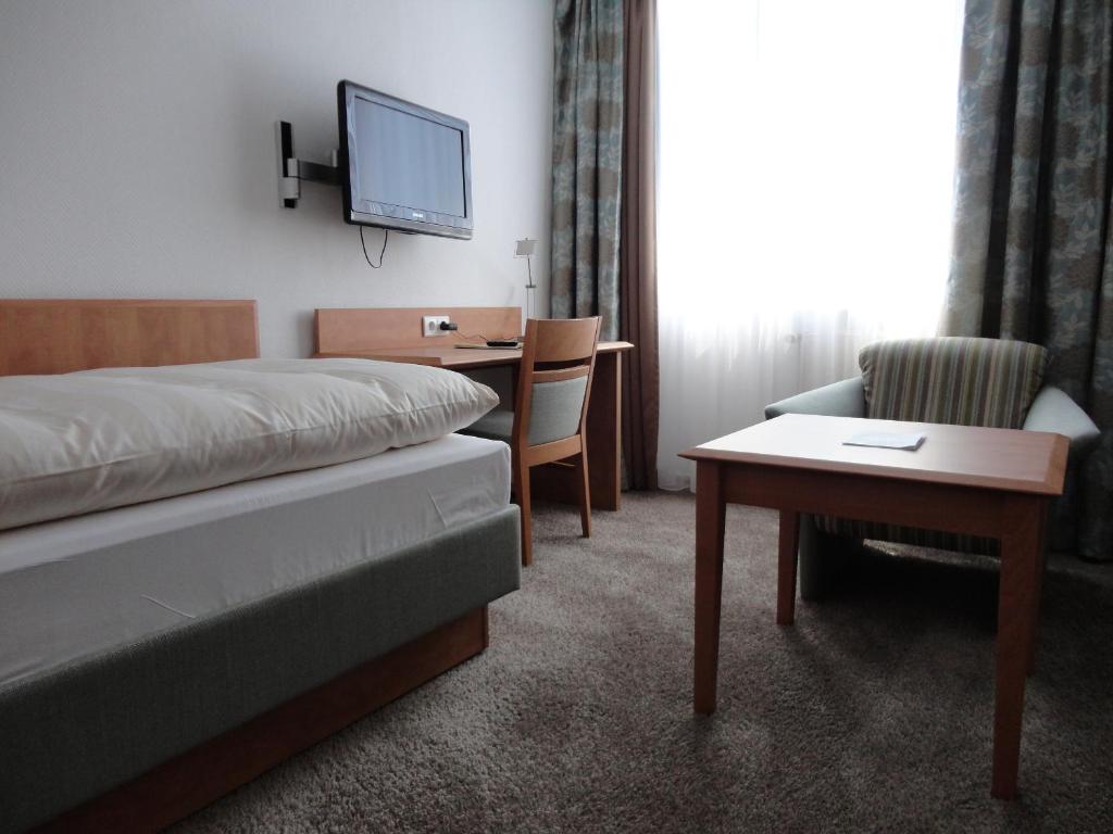 Postel nebo postele na pokoji v ubytování Hotel Flörke