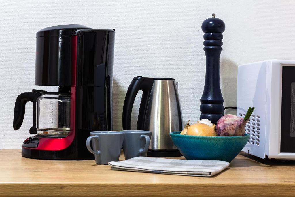 Příslušenství pro přípravu čaje a kávy v ubytování Innergårdens Bed and Breakfast