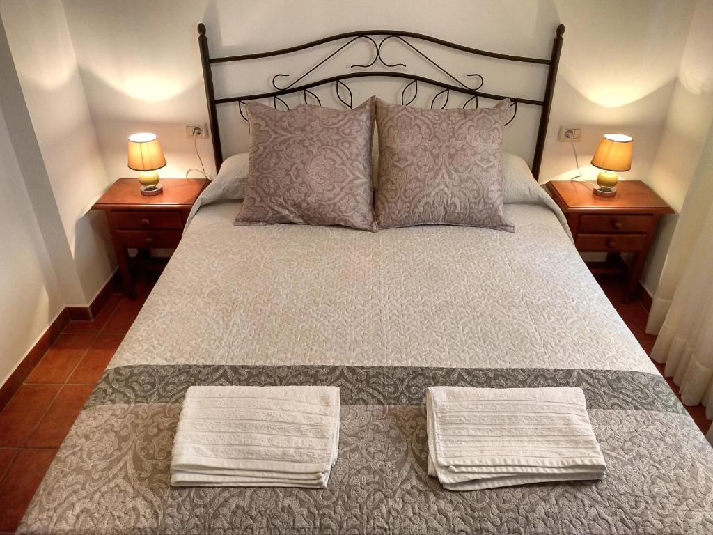 Postel nebo postele na pokoji v ubytování Apartamentos El Jablito