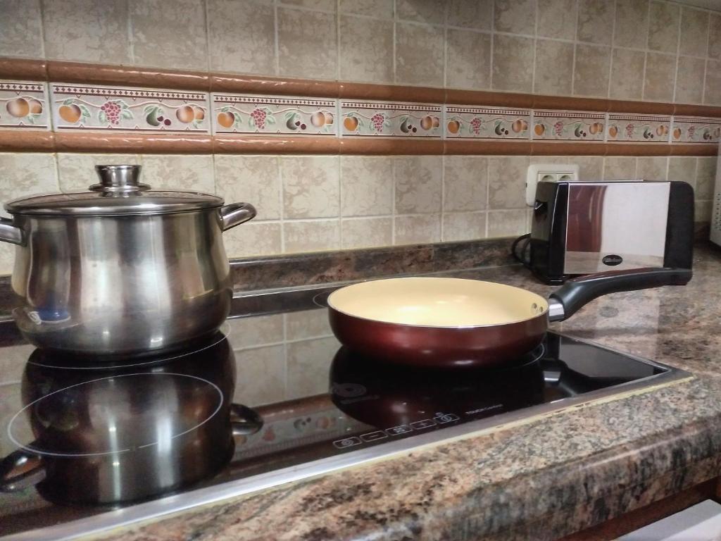 Kuchyň nebo kuchyňský kout v ubytování Apartamentos El Jablito