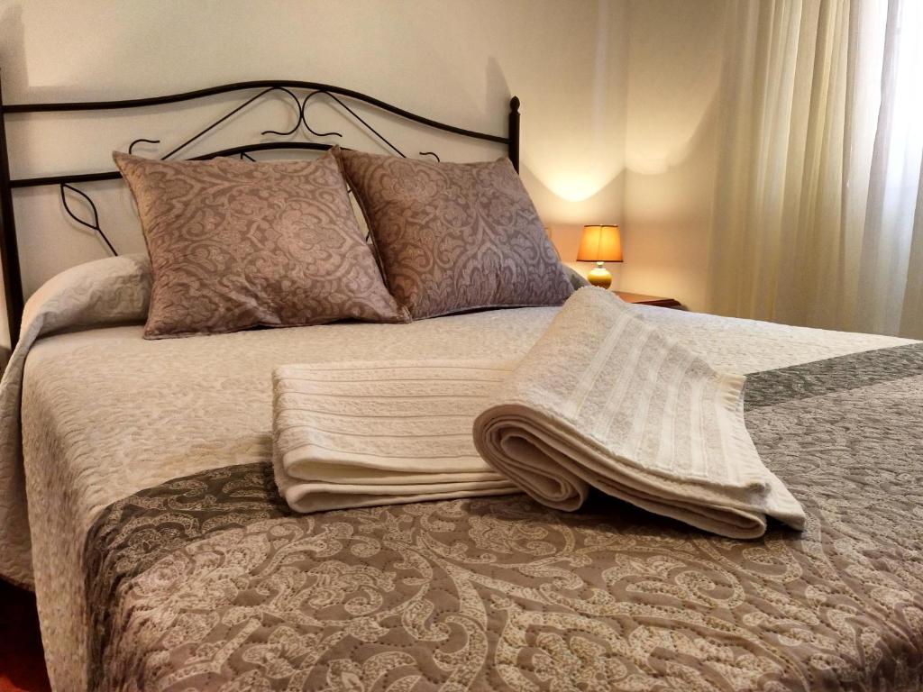 Postel nebo postele na pokoji v ubytování Apartamentos El Jablito