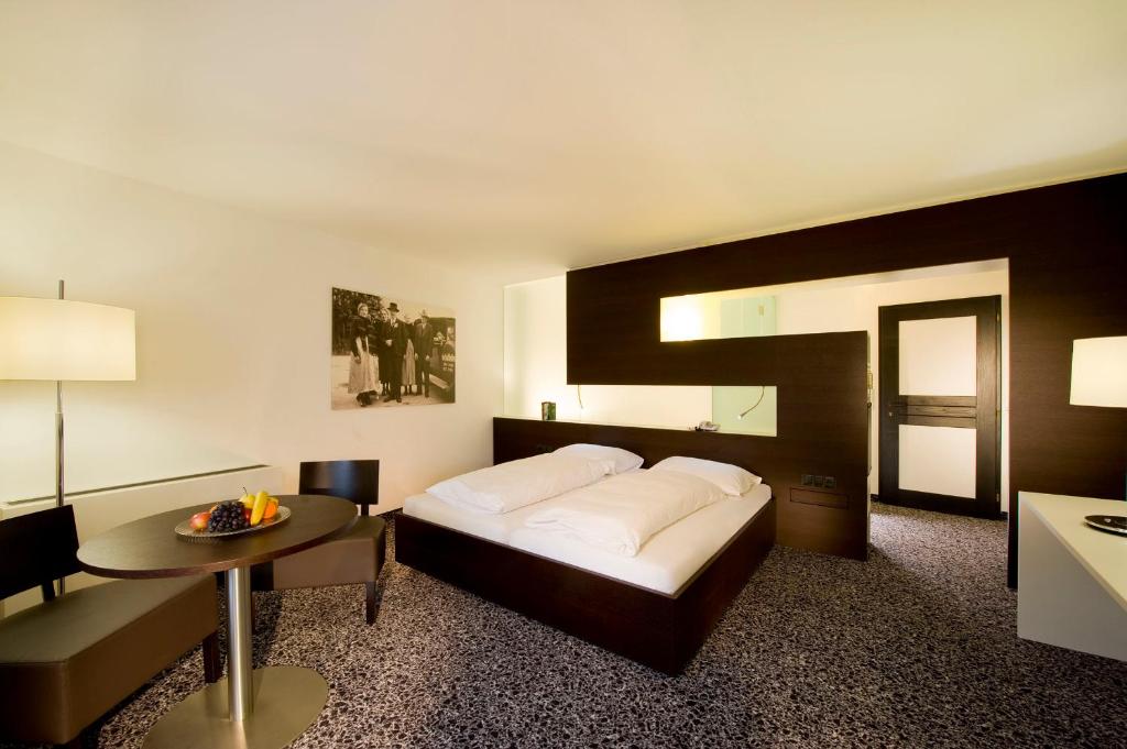 Säng eller sängar i ett rum på Hotel Rauter