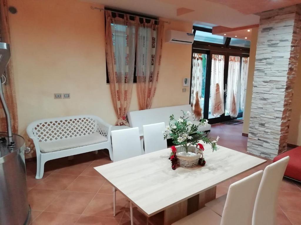 a living room with a white table and chairs at Sole&Mare in Monopoli