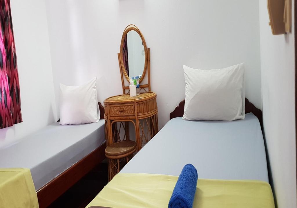 Postel nebo postele na pokoji v ubytování Smiley's Guesthouse