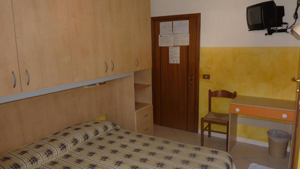 Postel nebo postele na pokoji v ubytování Hotel Canova