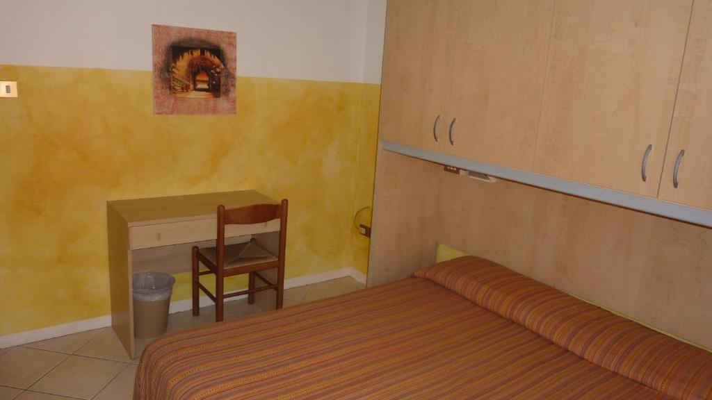 Postel nebo postele na pokoji v ubytování Hotel Canova