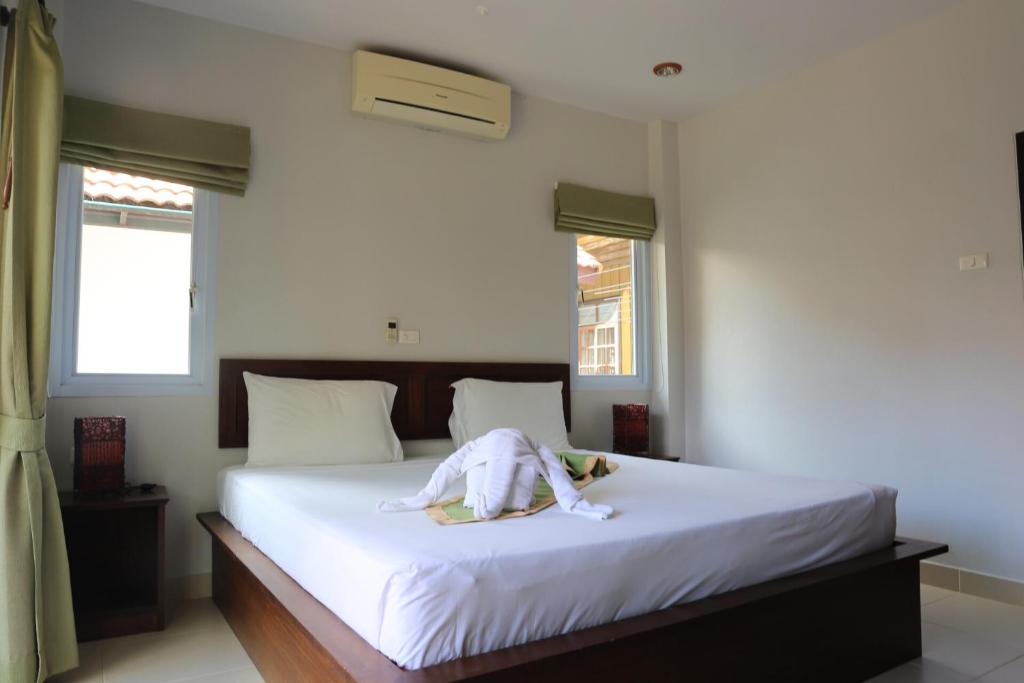 Postel nebo postele na pokoji v ubytování Shangrilah Bungalow