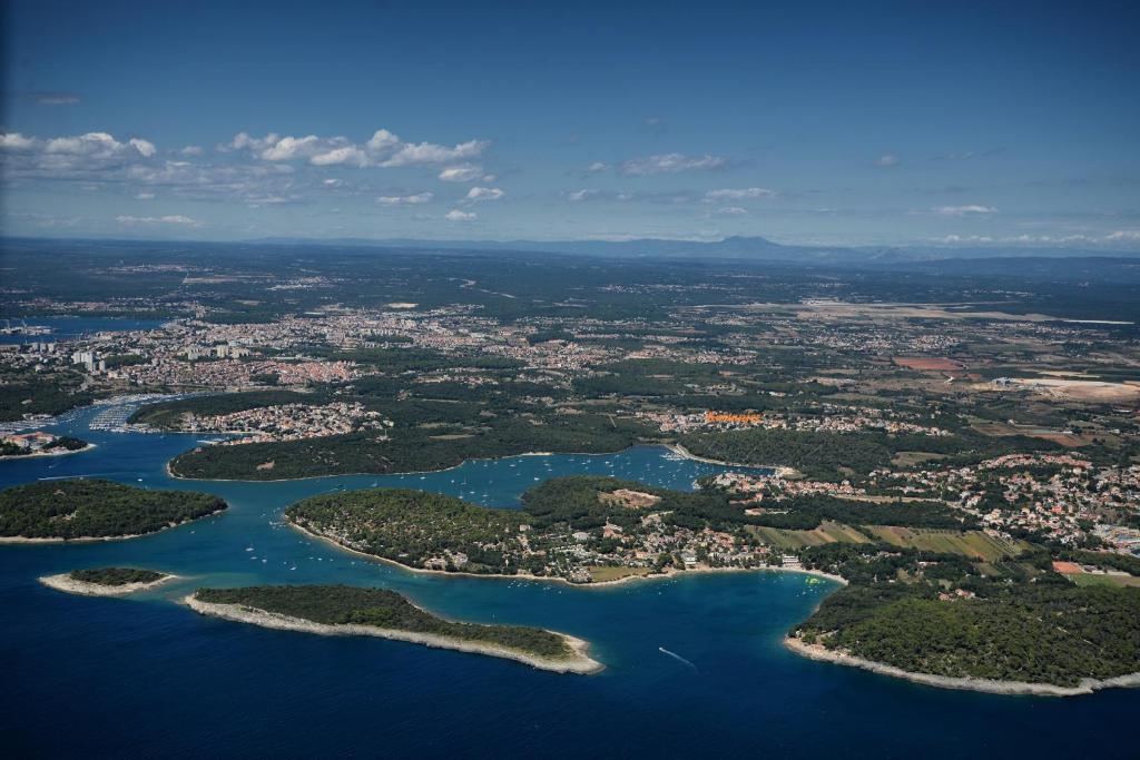 an aerial view of a group of islands and water at Apartments villa MaVeRo in Banjole