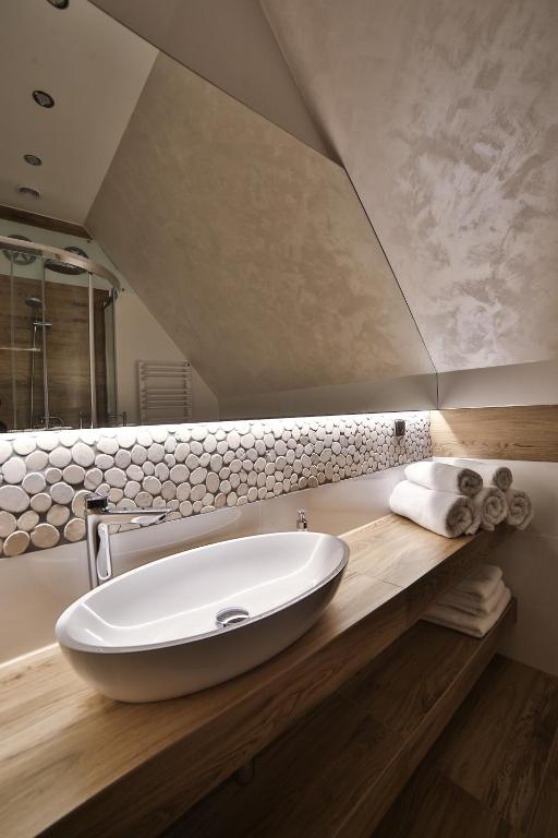 Kúpeľňa v ubytovaní Apartamenty Kościelisko