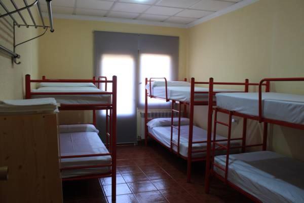 Postel nebo postele na pokoji v ubytování Albergue Los Chorros