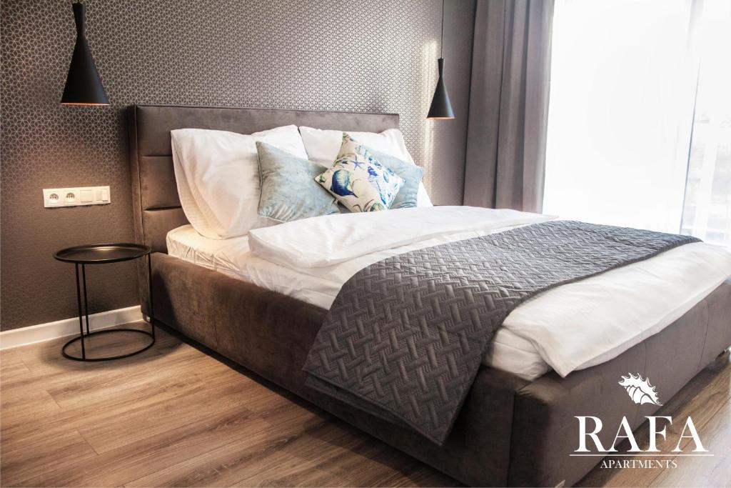Posteľ alebo postele v izbe v ubytovaní RAFA Apartments