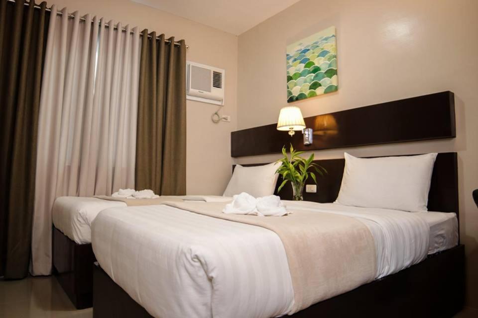 Postel nebo postele na pokoji v ubytování Mezza Hotel