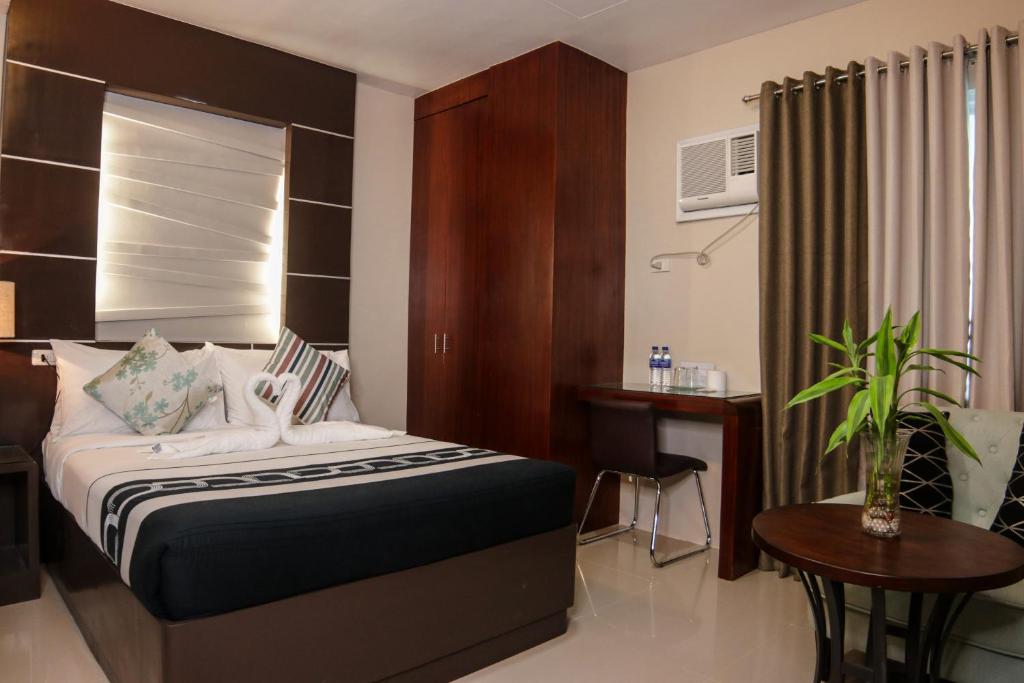 Postel nebo postele na pokoji v ubytování Mezza Hotel