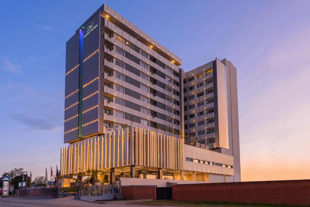 a tall building with lights on the side of it at Neelkanth Sarovar Premiere in Lusaka